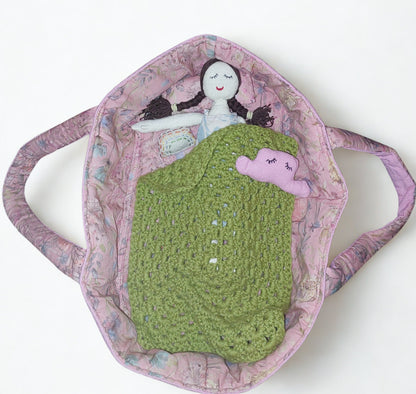 Doll in bed basket